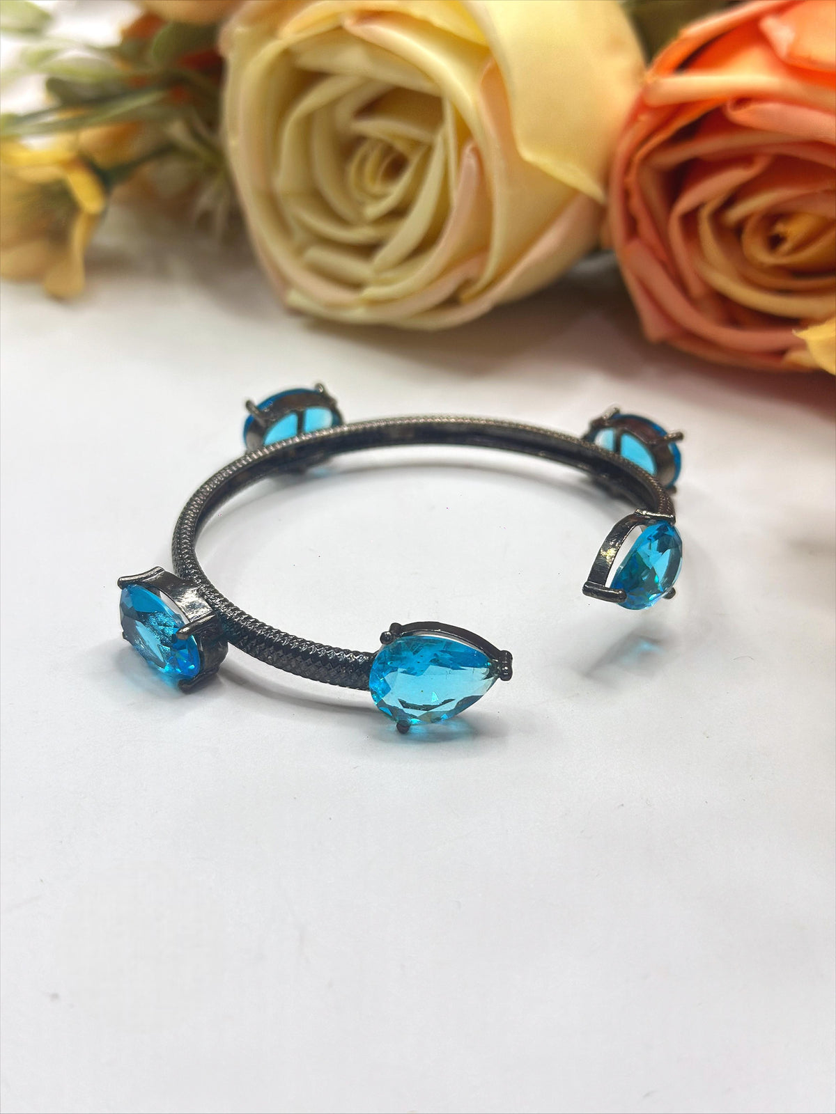 Elegant Black-Plated Open Bangle with Blue Crystal Stones β Modern Fashion Jewelry - Libasaa.com