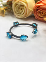 Elegant Black-Plated Open Bangle with Blue Crystal Stones β Modern Fashion Jewelry - Libasaa.com