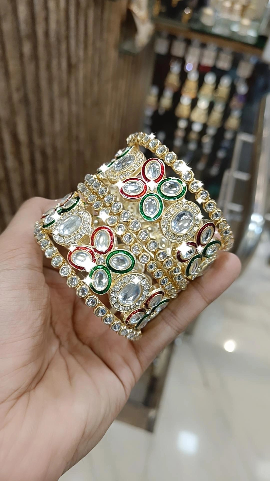 Gold Kundan Bangles with Red-Green Crystal Accents and Stone Detailing - Libasaa.com
