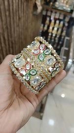 Gold Kundan Bangles with Red-Green Crystal Accents and Stone Detailing - Libasaa.com