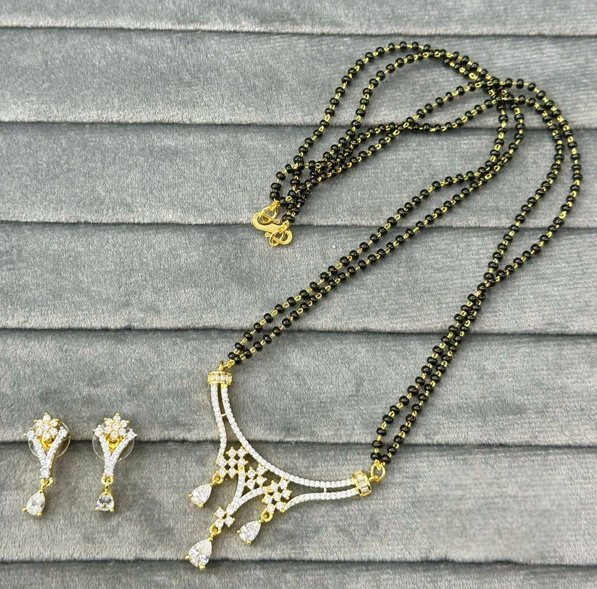 Elegant Black Beads Mangalsutra Set with Diamond Pendant and Matching Earrings