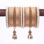 Indian bangle set , Bridal bangles, Metal bangles, Traditonal wedding jewelry, Brass Metal and Pearl Bridal Bangle Set with Jhumki - Libasaa