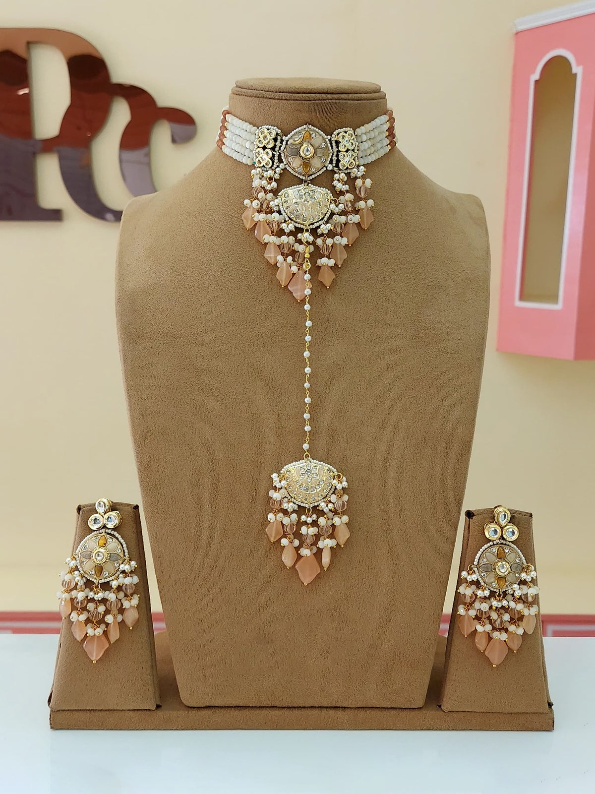 Bridal jewelry set featuring traditional Indian maangtik necklace and earrings perfect for weddings and celebrations